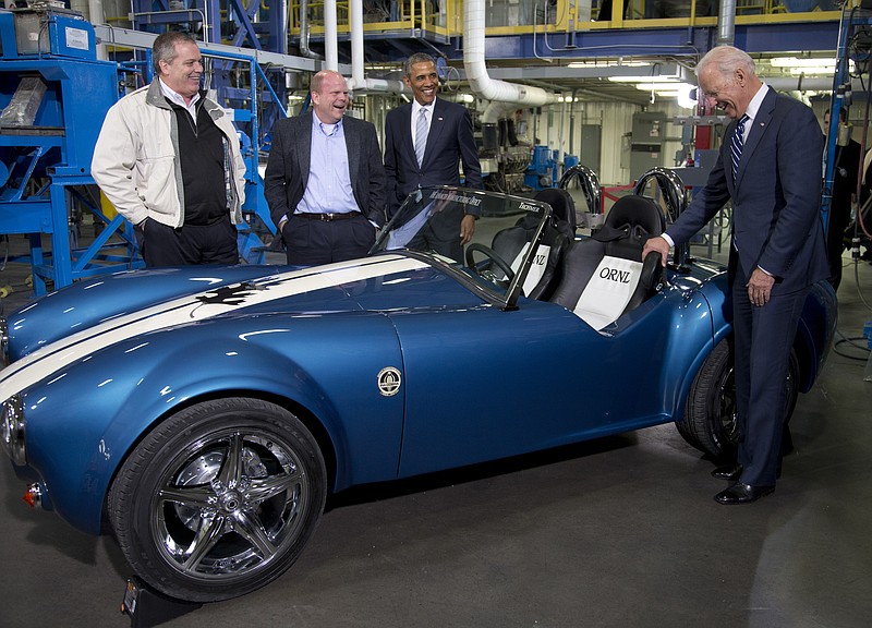 From left, Tom Drye, managing Director of Techmer ES; Lonnie Love, Shelby Cobra 3D print designer and manufacturer at Oak Ridge National Lab; President Barack Obama; and Vice President Joe Biden admire a 3D printed Shelby Cobra at Techmer PM, a plastic fabrication company Friday in Clinton, Tenn., where the president talked about the administration's efforts to create new, good-paying manufacturing jobs.