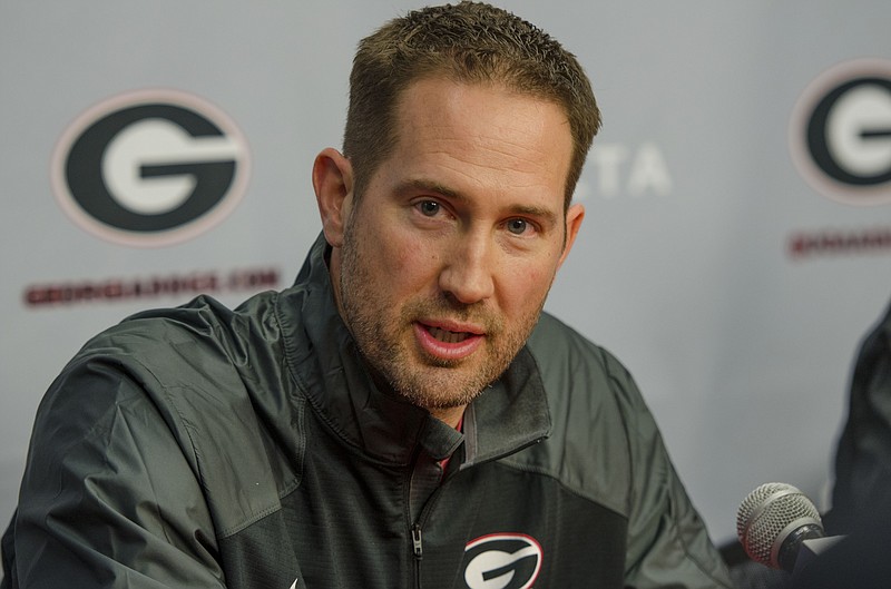 New Georgia offensive coordinator Brian Schottenheimer answers questions during a news conference Friday in Athens, Ga., in this file photo.
