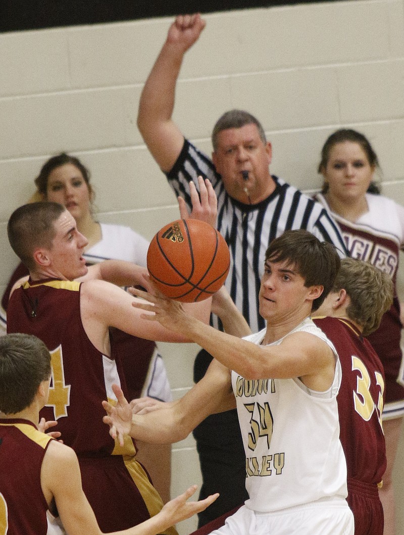 Van Buren County's Drew Roberts, left, and Lookout Valley's Austin Stansifer go for a rebound Friday at Lookout Valley High School.