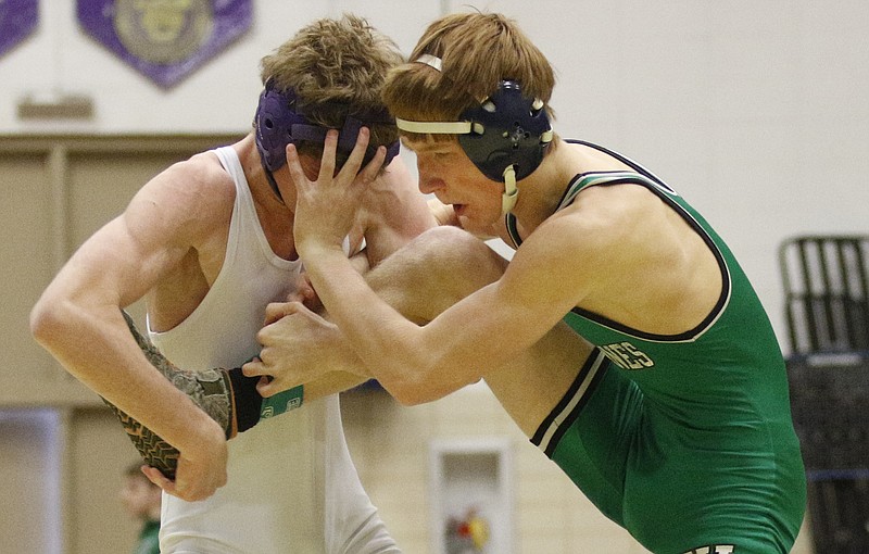 East Hamilton's Matthew Meeks wrestles Central's Bryson Lemons in their Central Invitational wrestling tournament championship bout Saturday at Central High School in Harrison.