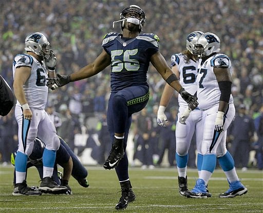Seattle Seahawks defensive end Cliff Avril celebrates against the Carolina Panthers during their game in Seattle, Saturday, Jan. 10, 2015. 