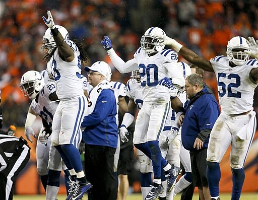 The Indianapolis Colts celebrate a fourth down stop against the Denver Broncos during their game, Sunday, Jan. 11, 2015, in Denver.