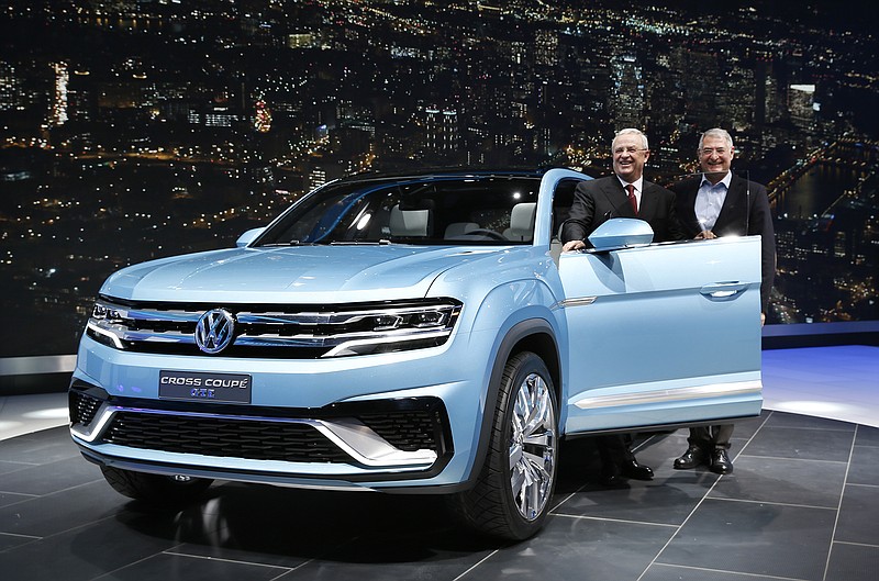 Martin Winterkorn, left, Chairman of the board of management of Volkswagen AG, and Heinz-Jakob Neuber, left, Member of the board of management for the Volkswagen brand introduce the Volkswagen Cross Coupe GTE Concept at media previews for the North American International Auto Show in Detroit on Sunday.