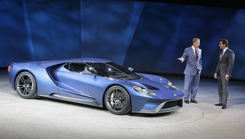 Ford Motor Co., Executive Chairman Bill Ford, left, and President and COO Mark Fields stand next to the new Ford GT during the North American International Auto Show on Monday, Jan. 12, 2015 in Detroit.