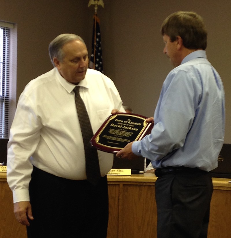 Kimball Mayor Rex Pesnell, left, presents David Jackson with a plaque in this Sept. 4, 2014, file photo. 