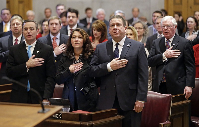 House members, including Rep. Glen Casada, R-Franklin, left; Rep. Gerald McCormick, R-Chattanooga, center right; and Rep. Charles Sargent, R-Franklin, right; salute the flag on the opening day of the 109th General Assembly in Nashville in this file photo.