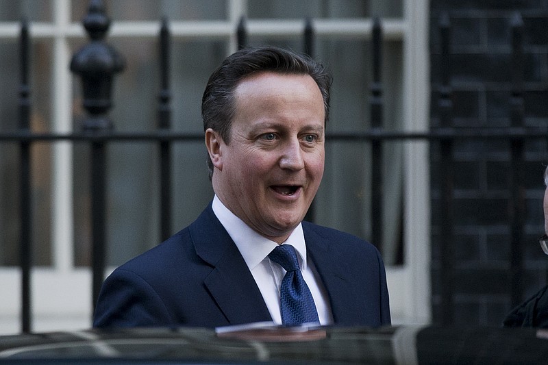 
              British Prime Minister David Cameron gets into a car as he leaves 10 Downing Street in London, to attend Prime Minister's Questions at the Houses of Parliament, Wednesday, Jan. 14, 2015.  (AP Photo/Matt Dunham)
            