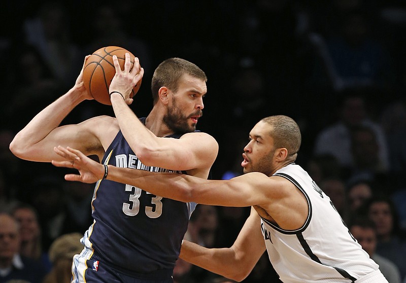 Brooklyn Nets center Jerome Jordan (9) defends Memphis Grizzlies center Marc Gasol (33) in their game at the Barclays Center, on Jan. 14, 2015, in New York.