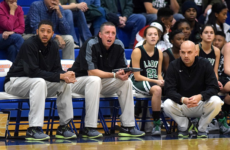 Notre Dame coaches, from left, De Lamb, Jason Hill and Wes Moore watch the action. 