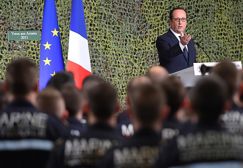 
              French President Francois Hollande delivers a speech during his visit on the French nuclear aircraft carrier Charles de Gaulle to present his New Year wishes to the French military troops, Wednesday, Jan. 14, 2015, off the coast of Toulon, southern France. France ordered prosecutors around the country to crack down on hate speech, anti-Semitism and glorifying terrorism and announced Wednesday it was sending an aircraft carrier to the Mideast to work more closely with the U.S.-led coalition fighting Islamic State militants. (AP Photo/Anne Christine Poujoulat, Pool)
            