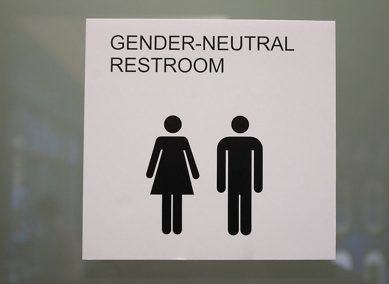 The sign for a gender-neutral restroom is in the new library on the campus of the University of Tennessee at Chattanooga.