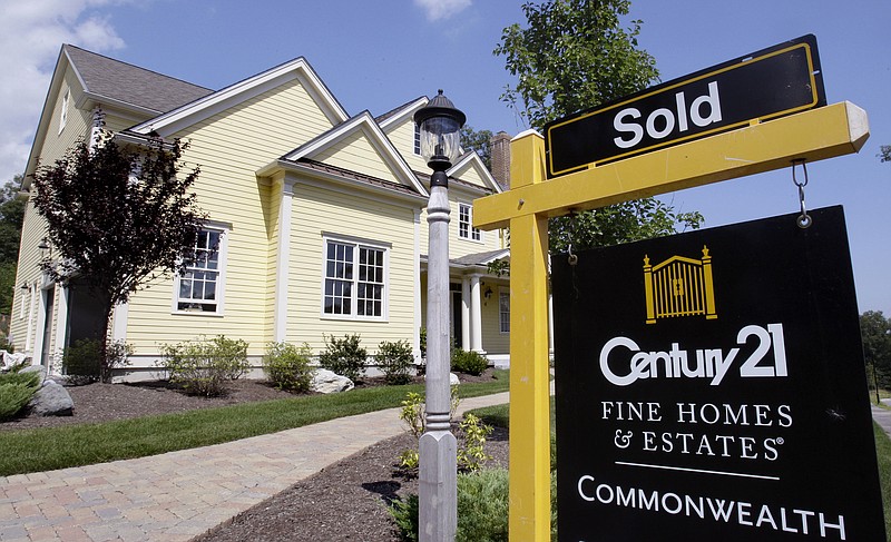 A sold sign is posted outside a  home in Wellesley, Mass. Home sales dipped in August after a four-month streak of gains, providing evidence that the housing market recovery remains fragile.