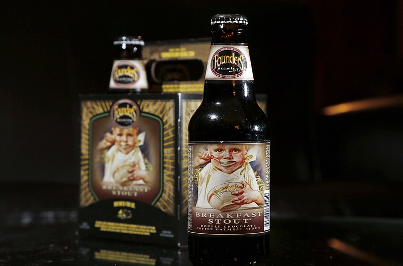 
              Founders Brewing Breakfast Stout is photographed in North Andover, Mass., Thursday, Jan. 15, 2015. Babies and bottles normally get along just fine, unless a picture of that baby happens to be plastered to the front of a bottle of beer being sold in New Hampshire. Currently, that bottle of Breakfast Stout crafted by Founders Brewery Co. in Grand Rapids, Mich., is illegal in the Granite State but legislation proposed this year would permit brewers to peddle their ales, stouts, porters and lagers even if the label shows images of minors. (AP Photo/Elise Amendola)
            