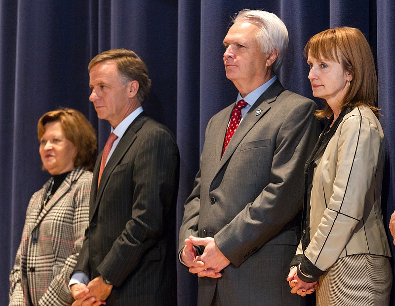 Members of all three branches of state government appear on stage during a charity event in Nashville on Friday, Jan. 16, 2015. From right are House Speaker Beth Harwell, Senate Speaker Ron Ramsey, Gov. Bill Haslam and state Supreme Court Chief Justice Sharon Lee. House and Senate Republicans are at odds about which chamber should go first on taking up Haslam's proposal to extend health coverage to 200,000 low-income Tennesseans.