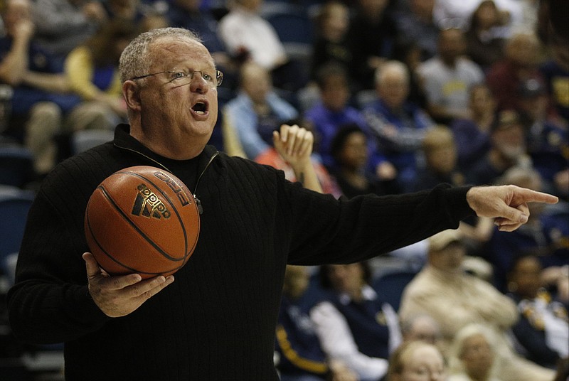 UTC women's basketball coach Jim Foster directs players during the Mocs' game against the Western Carolina Catamounts on Saturday, Jan. 17, 2015, at McKenzie Arena.