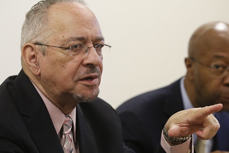 Rev. Jeremiah Wright, Jr., talks with people as they pass to get their plates Saturday, Jan. 17, 2015, at a prayer breakfast hosted by Tucker Missionary Baptist Church in Chattanooga, Tenn., to begin a week-long celebration of the Martin Luther King, Jr., holiday. Rev. Wright, former pastor to President Barack Obama, was the keynote speaker at the breakfast.
