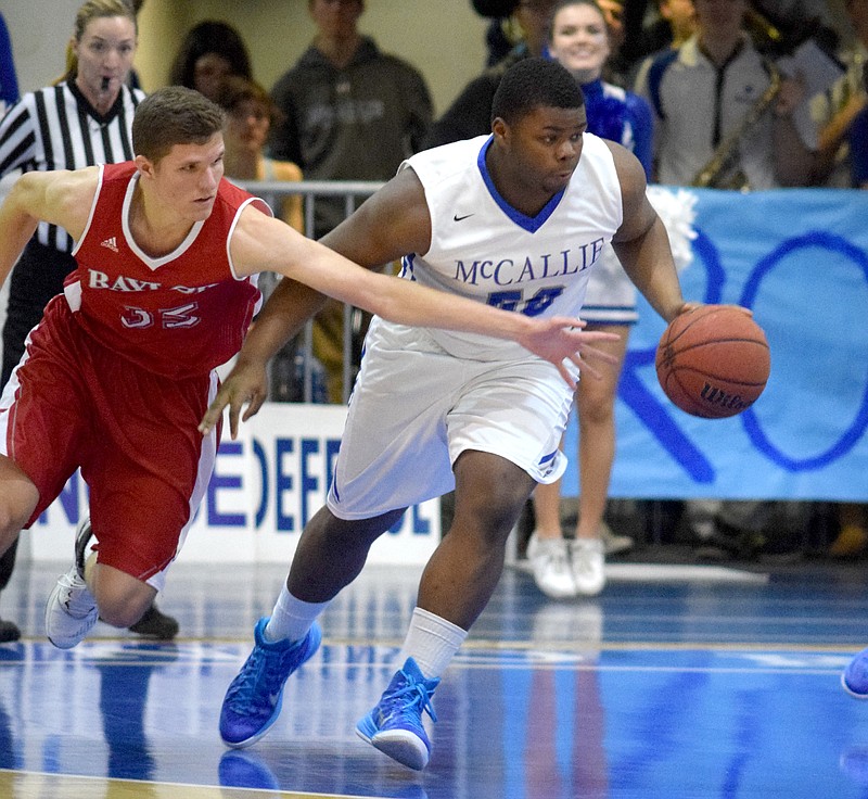 Baylor's Bennett Taylor (33) attemtps to steal the ball from McCallie's Corey McDonald (50) Saturday night at the McCallie School.