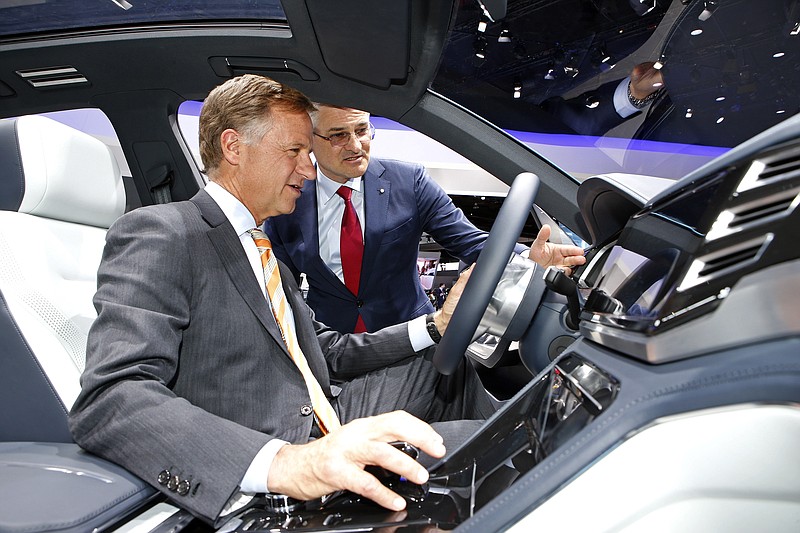 Tennessee Gov. Bill Haslam visited with Volkswagen Group of America Chief Executive Michael Horn at the North American International Auto Show in Detroit last week. Haslam got behind the wheel of a concept of a new sport utility vehicle that could be made at VW's Chattanooga plant.