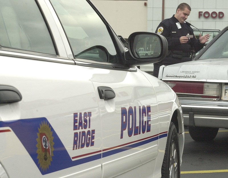 An East Ridge patrolman talks with a motorist he pulled over in this 2003 file photo.