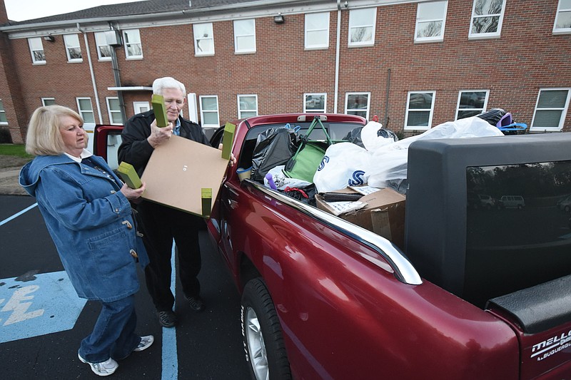 Anna Carol Dishroon, and her husband E.J. Dishroon top off their load of donations from home for the Grundy County Mission Trip Wednesday at Oakwood Baptist Church on Bonny Oaks Drive.