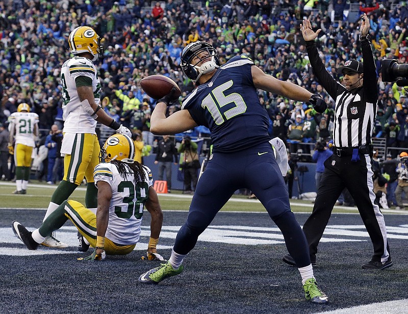 Seattle Seahawks' Jermaine Kearse celebrates after catching the game-winning touchdown during overtime of the NFL football NFC Championship game against the Green Bay Packers Sunday, Jan. 18, 2015, in Seattle. The Seahawks won 28-22 to advance to Super Bowl XLIX.
