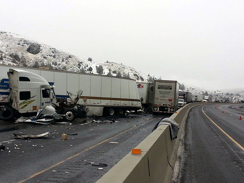 This photo provided by the Oregon Department of Transportation shows the scene of an accident on I-84 in Oregon Saturday, Jan. 17, 2015. Black ice is believed to be the cause of a freeway pileup involving more than a dozen tractor-trailers Saturday morning in eastern Oregon, police said.