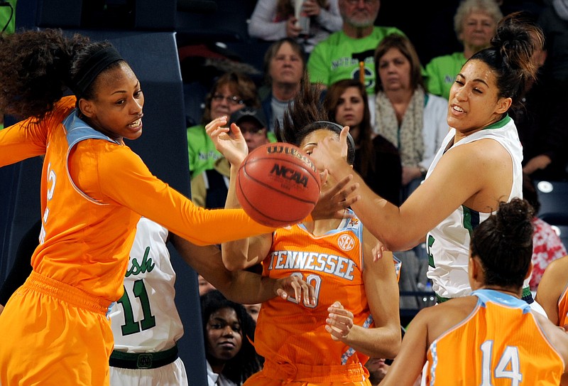 Tennessee forward Bashaara Graves, left, Isabelle Harrison and Notre Dame forward Taya Reimer vie for the ball in the first half of an NCAA college basketball game Monday, Jan. 19, 2015, in South Bend, Ind.