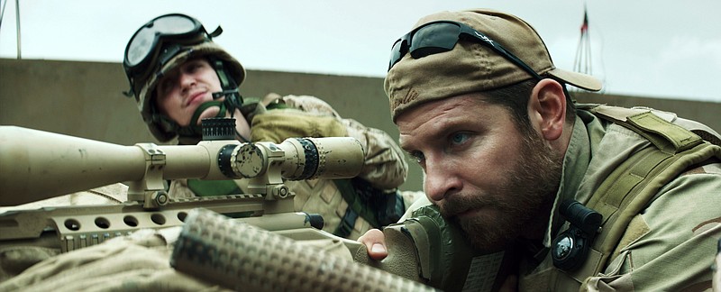 
              In this image released by Warner Bros. Pictures, Kyle Gallner, left, and Bradley Cooper appear in a scene from "American Sniper."  The film is based on the autobiography by Chris Kyle. (AP Photo/Warner Bros. Pictures)
            