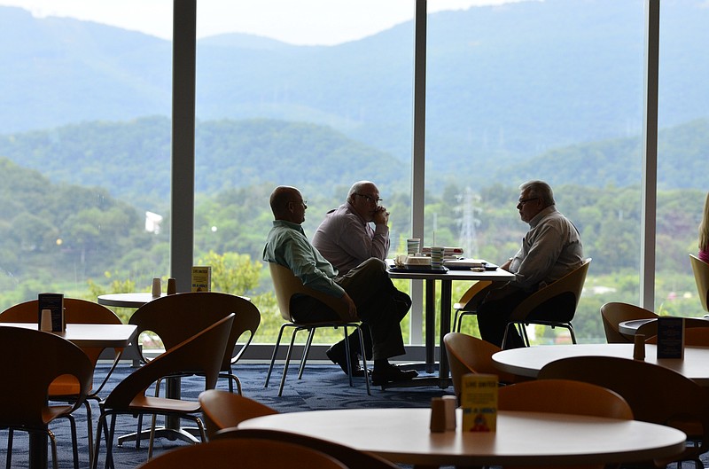 Lee Maiser, left, Bud Bishop, center and Dale Varnes talk after eating lunch at the cafeteria at Blue Cross Blue Shield in Chattanooga, Tenn., on Tuesday, September 9, 2014. 