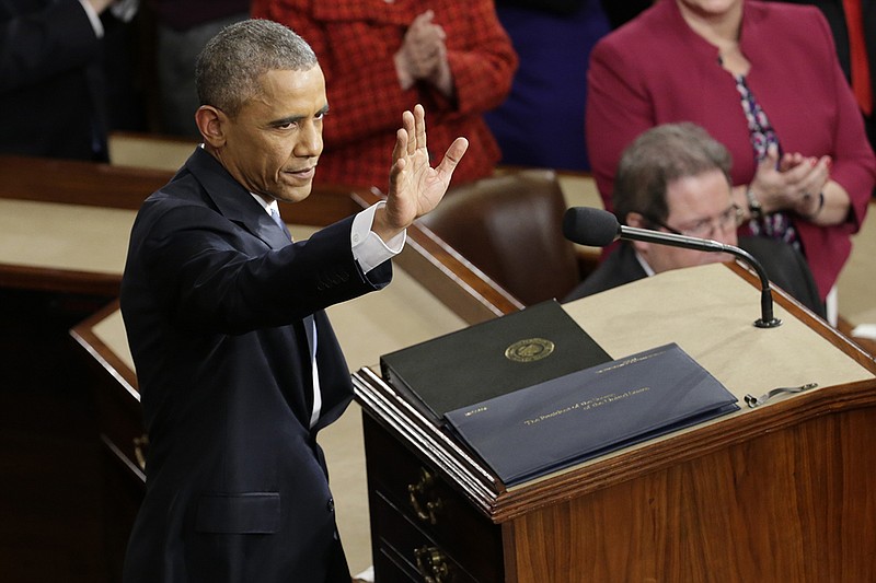 President Barack Obama waves before giving his State of the Union address before a joint session of Congress on Capitol Hill in Washington on Tuesday, Jan. 20, 2015.