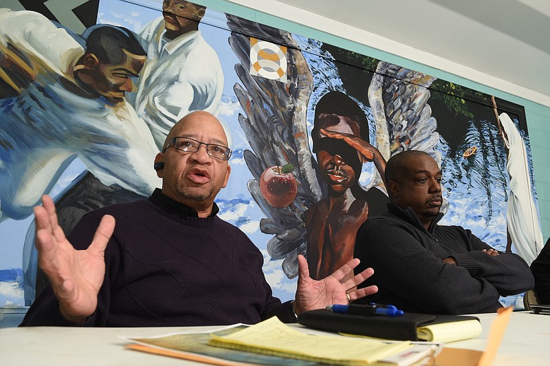 Pastors Ron Cook and E. Jonathan Thomas, from left, speak Wednesday at the Avondale Youth and Family Development Center in Chattanooga, Tenn., about plans for a series of Jan. 24 community prayer gatherings. The prayer events will be held in four community centers in an effort to address violence and other community problems.