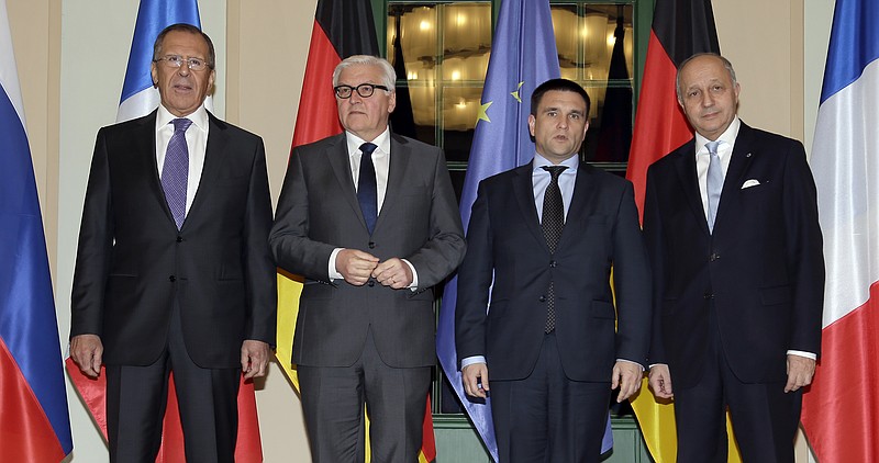 German Foreign Minister Frank-Walter Steinmeier, second left, welcomes his counterparts from France, Laurent Fabius, right, Russia, Sergey Lavrov, left, and Ukraine, Pavlo Klimkin, second right, for a meeting in Berlin on Jan. 21, 2015.