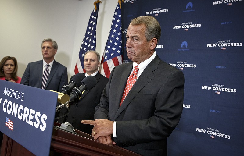 Speaker of the House John Boehner, R-Ohio, talk to reporters at the Capitol in Washington on Jan. 21, 2015. 