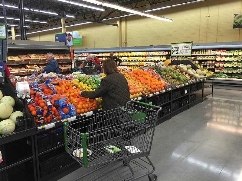 The first customers shop at the new Walmart Neighborhood Market  in Fort Oglethorpe, Ga.