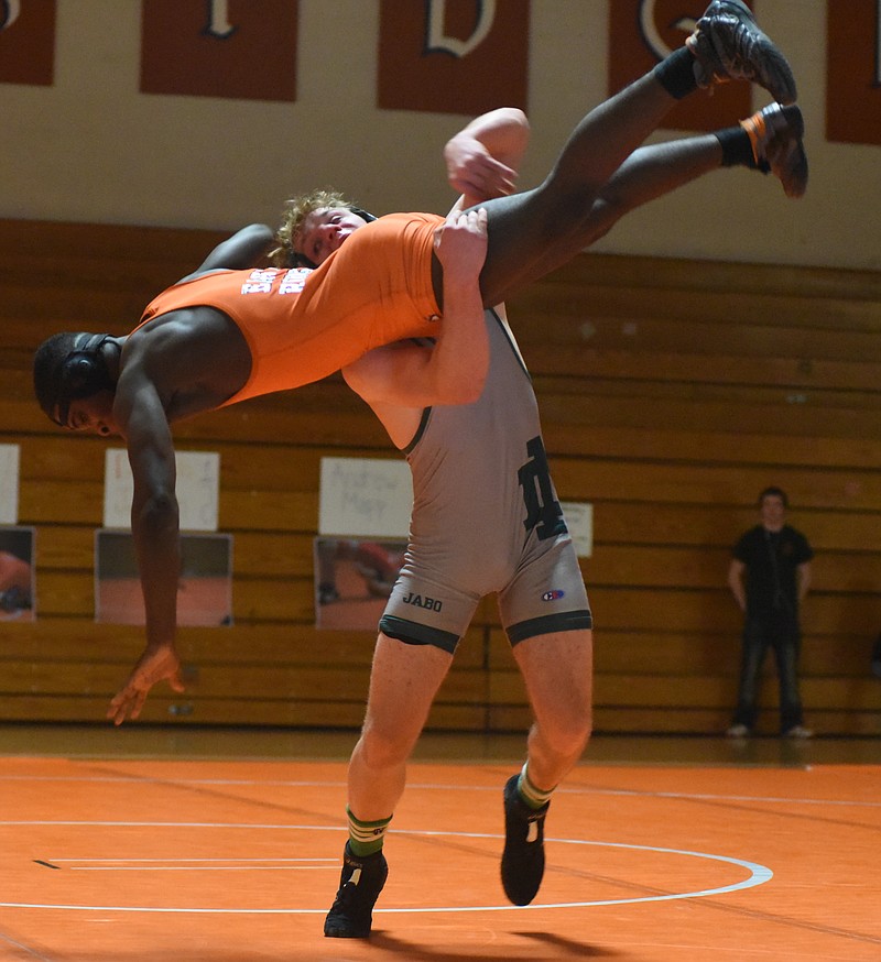 Noah Bankston of Notre Dame High School lifts Jalyn Allen of East Ridge during their 152-pound match Thursday at East Ridge.