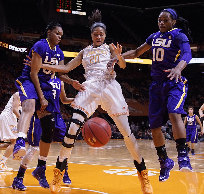 Tennessee's Isabelle Harrison (20) makes sure the ball rolls out of bounds as she holds back LSU's Ann Jones, left, and Jasmine Rhoads (10) in their game Thursday, Jan. 22, 2015, in Knoxville.