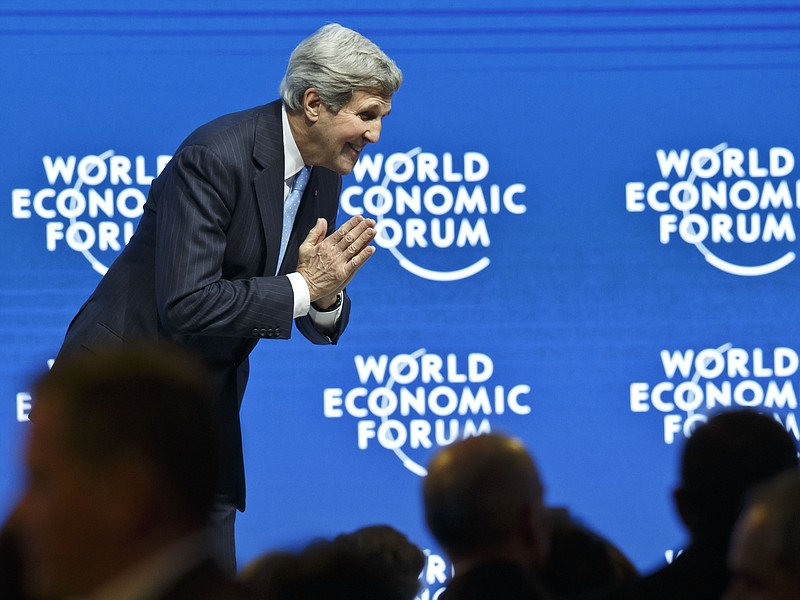 
              U.S. Secretary of State John Kerry bows to someone after his speech during a panel session at the World Economic Forum, in Davos, Switzerland, Friday, Jan. 23, 2015. (AP Photo/Michel Euler)
            