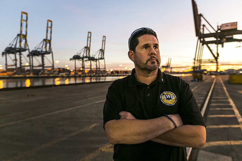 Bobby Olvera, Jr., president of the union's Local 13 branch, tours an unusually quiet dock at the Port of Los Angeles in this Jan. 14, 2015, photo.