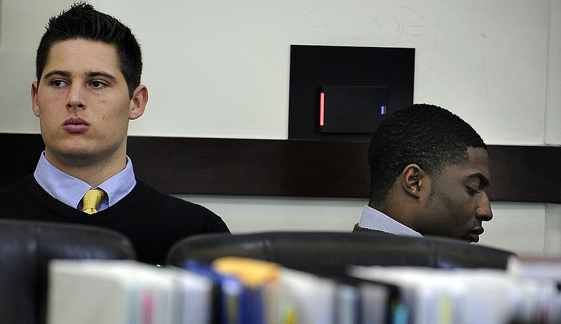 Brandon Vandenburg and Corey Batey wait for court to start during day six of the Vanderbilt rape trial on Monday, Jan. 19, 2015, in Nashville.