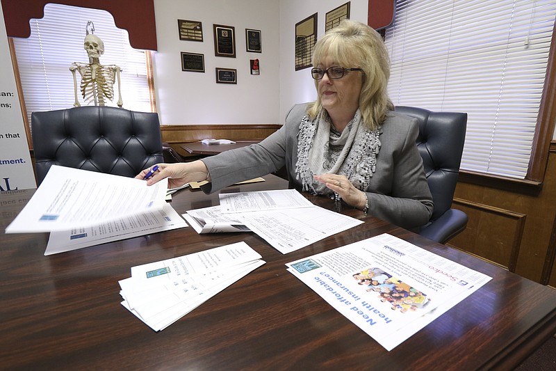 Nancy Ridge, program manager for the Chattanooga Medical Society, attempts to simplify a series of steps that some area residents will need to take in providing their health insurance status to the government while filing taxes this year. 