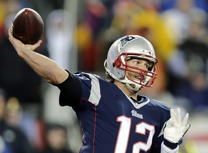 In this photo taken Sunday, Jan. 18, 2015, New England Patriots quarterback Tom Brady throws a pass during the first half of the AFC championship NFL football game against the Indianapolis Colts in Foxborough, Mass.