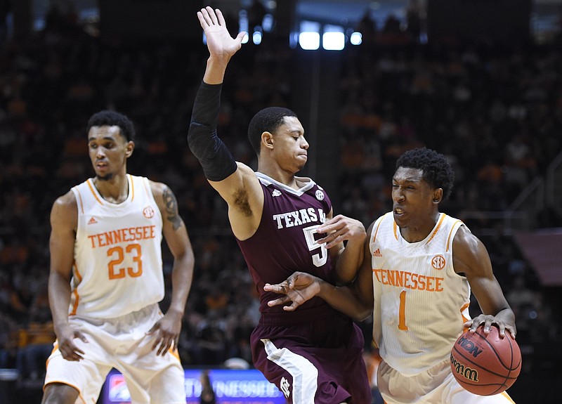 Tennessee guard Josh Richardson, right, is called for a foul against Texas A&M guard Jordan Green as Tennessee guard Derek Reese, left, looks on during the Vols' 67-61 loss Saturday at Thompson-Boling Arena in Knoxville. The Vols are battling to stay in the top half of SEC standings.