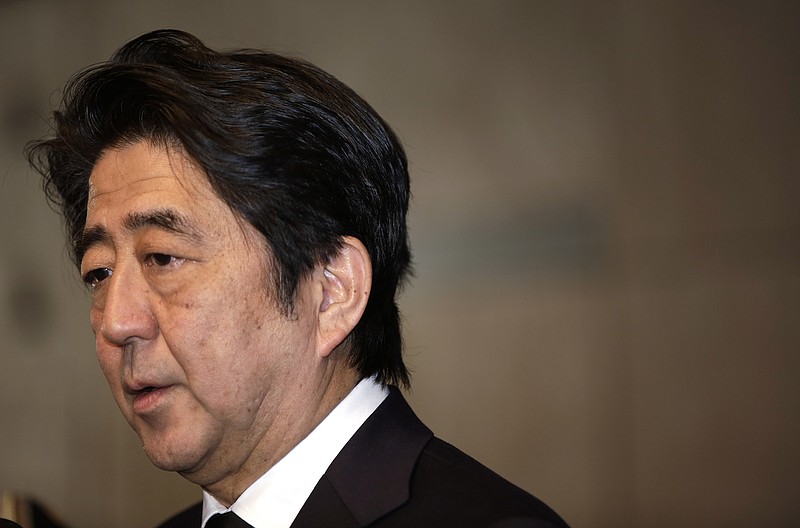 Japanese Prime Minister Shinzo Abe speaks to the media after he signed a book of condolence for the late King Abdullah of Saudi Arabia at Saudi Arabian Embassy in Tokyo on Sunday, Jan. 25, 2015. 