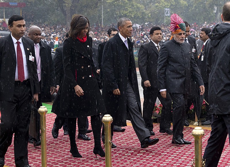 
              U.S. President Barack Obama, second right, and first lady Michelle Obama, second left, are greeted by Indian Prime Minister Narendra Modi, right, as they arrive for Republic Day in New Delhi, India, Monday, Jan. 26, 2015. Obama on Monday took in a grand display of Indian military hardware, marching bands and elaborately dressed camels, becoming the first American leader to be honored as chief guest at India’s annual Republic Day festivities. (AP Photo/Carolyn Kaster)
            