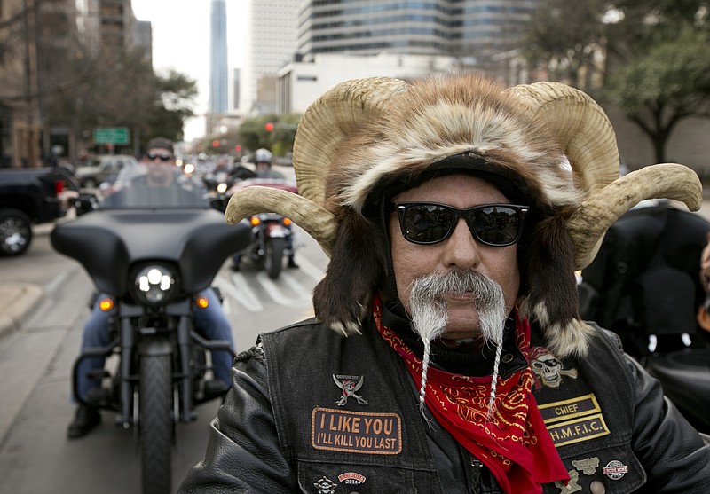 Rocket Navarro rides on Congress Avenue towards the Capitol for the Texas Confederation of Clubs and Independents Legislative Day, Monday, Jan. 26, 2015, in Austin, Texas. Hundreds of bikers from around Texas paraded for motorcycle rights. 