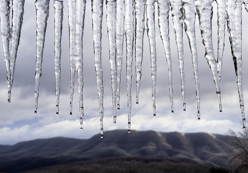 
              Icicles drip from the overhang of a picnic shelter at the Blacksburg Municipal "Hill" Golf Course  after a winter storm in Blacksburg, Va. on Saturday, Jan.  24 2015.  The National Weather Service has lifted a winter weather advisory for much of the Baltimore and Washington areas. But the advisory remains in effect until noon for western Maryland, western Virginia and points to the north.(AP Photo / The Roanoke Times, Matt Gentry)
            