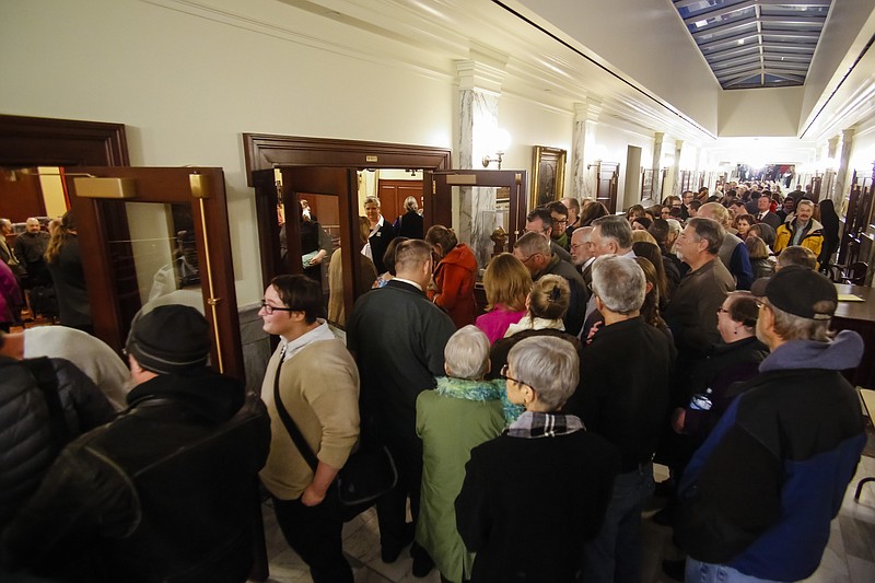 
              Hundreds of people line up to attend or testify at the House State Affairs Committee hearing on a bill that would include sexual orientation and gender identity protections to the state's Human Rights Act, at the state Capitol building, Monday, Jan. 26, 2015, in Boise, Idaho. (AP Photo/Otto Kitsinger)
            
