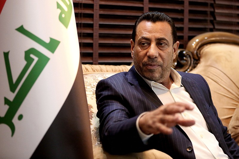 In this Thursday, Jan. 22, 2015, photo, Hakim al-Zamili, a parliament member and head of Security and Defense Committee speaks during an interview with The Associated Press in Baghdad, Iraq.