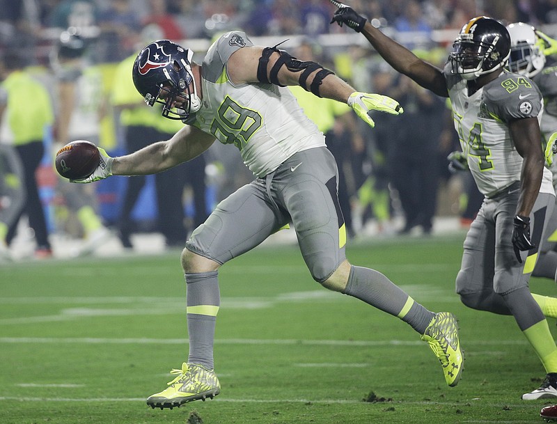 Houston Texans' J.J. Watt (99) celebrates after recovering a fumble during the second half of the NFL Football Pro Bowl Sunday, Jan. 25, 2015, in Glendale, Ariz.