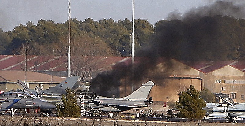 Smoke rises from a military base after a plane crash in Albacete, Spain, Monday, Jan. 26, 2015. 